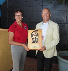 CHEK General Manager Roy McKenzie received thanks for their support of 2014 Swiftsure International Yacht Race from Charlotte Gann, head of Swiftsure's Sponsorship Relations.