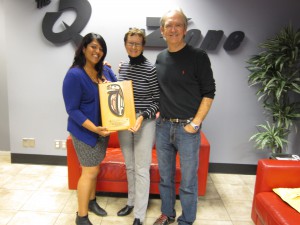 John Shields and Tindy Bassi of Q 100.3 and the Zone@91.3 accept their 2014 Sponsor Plaque from Charlotte Gann