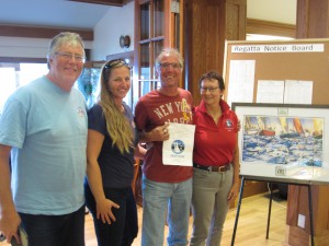 Crew of White Noise, including Marri Todd, gladly receive the free entry gift certificate for Swiftsure 2015 from Charlotte Gann.